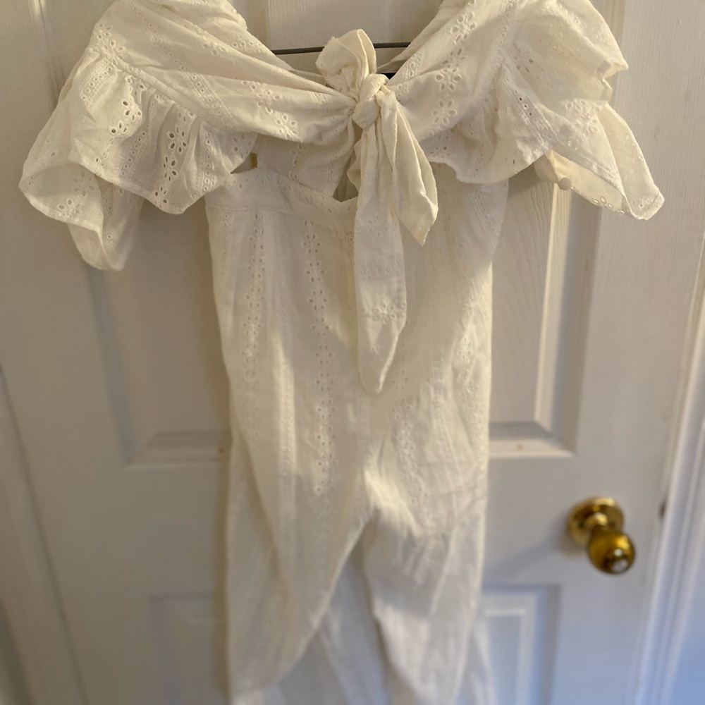 Blue Blush ruffled crocheted cropped white jumpsuit. New with tags! Beautiful